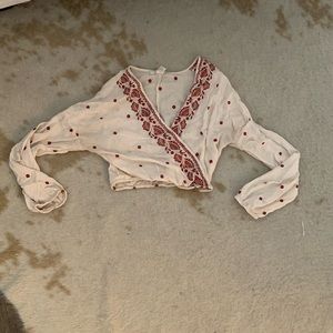 Embroidered long sleeve crop top surprise front